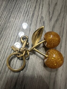 Coach Gold Tone Cherry Keychain with Glitter Amber Charms